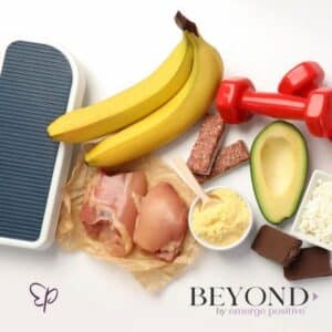 a scale next to bananas, weights, avocadoes and chicken